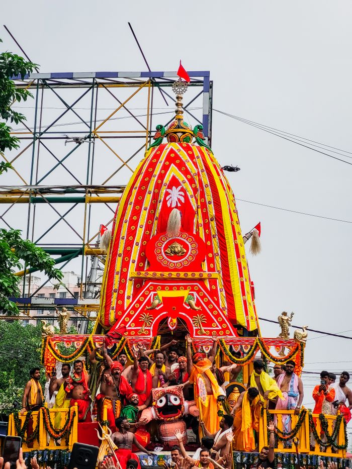 gallery-1 Vibrant Ratha Yatra festival parade with devotees and decorated chariot.